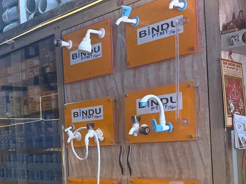 Wall-mounted display boards of Bindu and Aqwai taps, showers and bathroom fittings