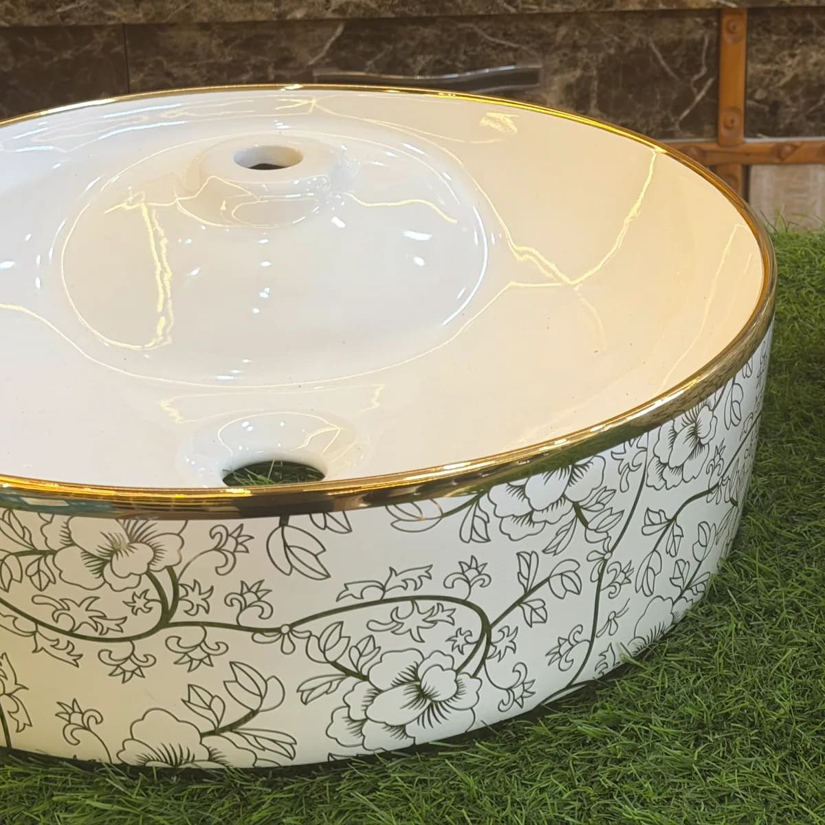 Two counter-top basins with gold-rimmed floral detailing